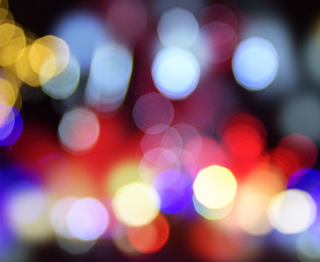 Fototapeta premium multicolored round bokeh on a black background