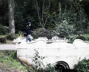 man with a camera in autumn park