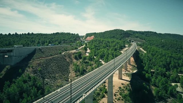 Aerial view of railroad bridge and tunnel in Spain