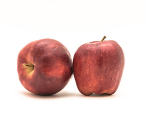 Studio shot close-sup studio shot two red delicious apples isolated on white background. Healthy organic snacks, raw whole fruit with clipping path and copy space