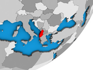 Albania on blue political 3D globe.