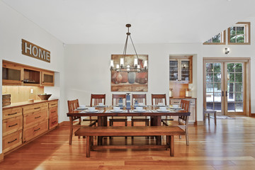 White spacious dining area with built in cabinets