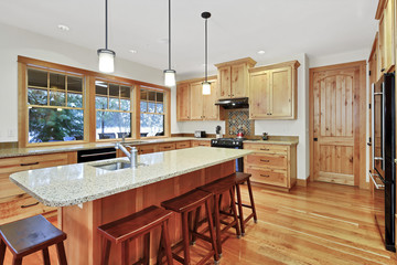 Beautiful kitchen with light wood cabinets