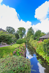 Fototapeta premium Noorderpad, Giethoorn, the Municipality Steenwijkerland, province of Overijssel, Netherlands, september 2, 2017: Rural houses village of Giethoorn in historical tourist wetland area