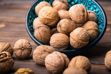 placer of walnuts on a wooden table