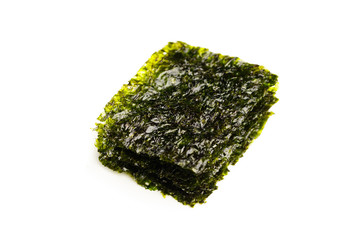 dried nori seaweed laminaria sheets, isolated on white © nikkytok