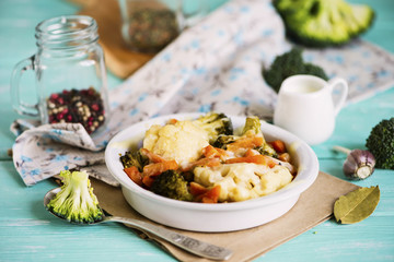 baked cauliflower and broccoli with cheese on a plate
