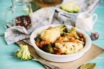 baked cauliflower and broccoli with cheese on a plate