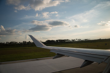 Airline airplane taking off. Looking out the window. wing and horizon. Escaping from reality, nomad life