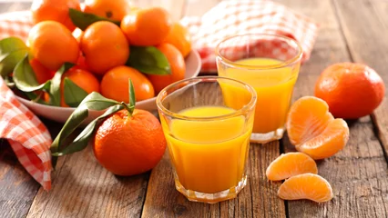 Abwaschbare Fototapete clementine fruit juice © M.studio