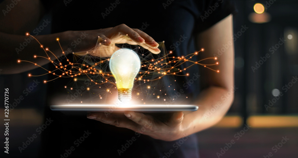 Poster Innovation. Hands holding tablet with light bulb future technologies and network connection on virtual interface background, innovative technology in science and communication concept .
