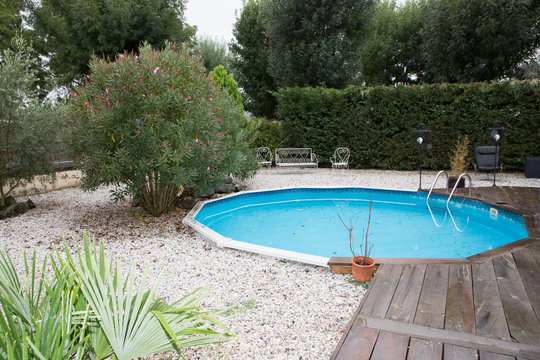 little round swimming pool in home garden