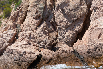 sea water splashing rocky coastline on the shores of Tossa De Mar