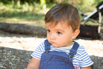 child boy looking side outdoor garden