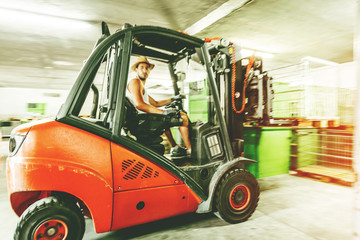 Warehouse man worker with forklift.