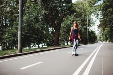 girl posing with skate board