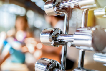 Fototapeta premium Close up of heavy weight in bright gym.