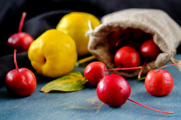 Ripe apple quinces and small red apples