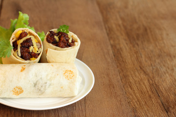 Burritos wraps with minced pork and vegetables.