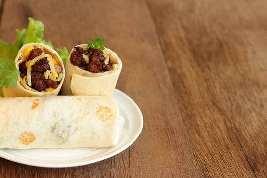 Burritos wraps with minced pork and vegetables.