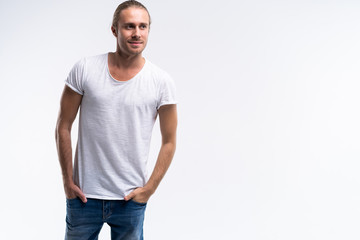 Handsome young guy posing in studio - isolated.