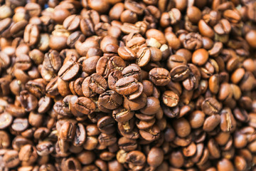 fresh roasted coffee beans in a pile