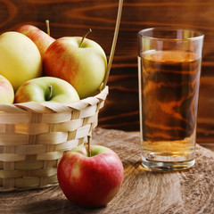 Apple cider in glass on wood background