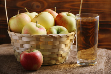 apple in basket on wood background