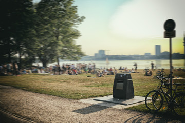 Alster Lake in Hamburg Germany View at beautiful and famous city park people Trashcan Bike