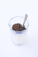 Chia seeds are drunk with airan from a glass.