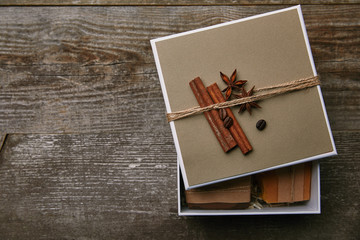 top view of handmade soap pieces in decorated box on rustic wooden table