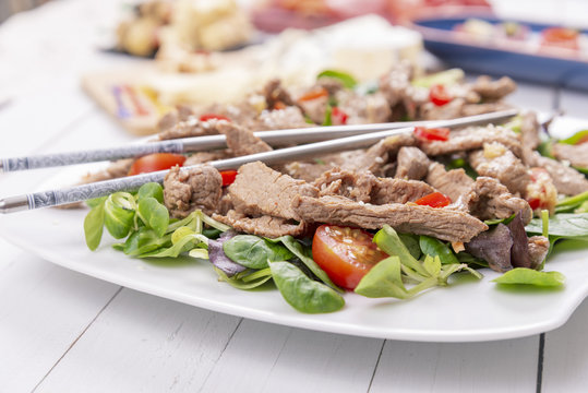 Asian salad with grilled beef