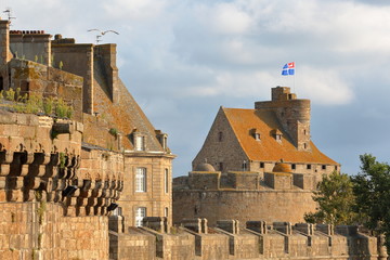 The Castle of Duchess Anne, located inside the walled city of Saint Malo, with the ramparts in the foreground, Saint Malo, Brittany, France - obrazy, fototapety, plakaty