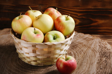 apple in basket on background wood and dark low key