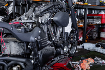 Fototapeta premium Cropped close up shot of beautiful and custom made motorcycle in the workshop