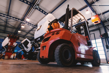 Picture of forklift in car repairing workshop. © Dusan Petkovic