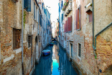 Fototapeta na wymiar Back alley canal in Venice Italy Neighborhood