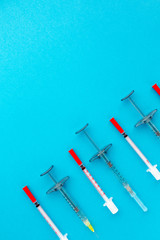 Flat lay of medical instruments on blue background. Mock up health care medical background.