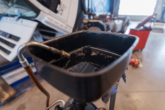 Picture of motor oil in car workshop.