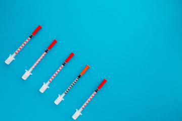 Flat lay of medical instruments on blue background. Mock up health care medical background.