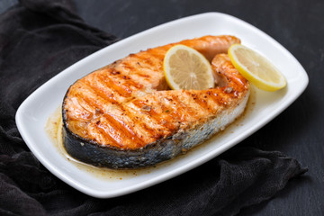 grilled salmon with lemon on dish