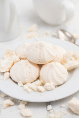 Fototapeta na wymiar merengues on white plate on white background