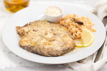fried blue shark with rice on white plate