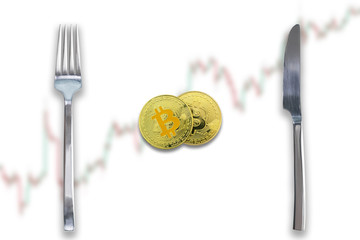 Two Bitcoins crypto currency between fork and knife. Concept of Bitcoin scalability problem. Cryptocurrency market deficit and limitations. Blurred trade chart going up background