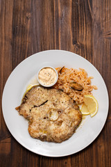 fried blue shark with rice on white plate