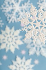 Artificial Snowflake With More Snowflakes In Background Close-up