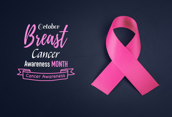 Pink ribbon on black background  for supporting breast cancer awareness month campaign.