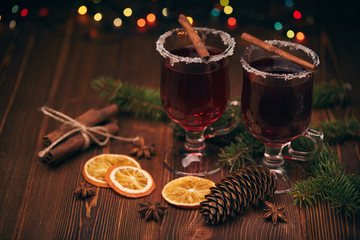 Glasses of mulled wine on wooden table