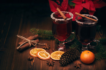 Glasses of mulled wine on wooden table