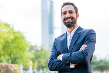 Portrait of successful businessman with arms crossed